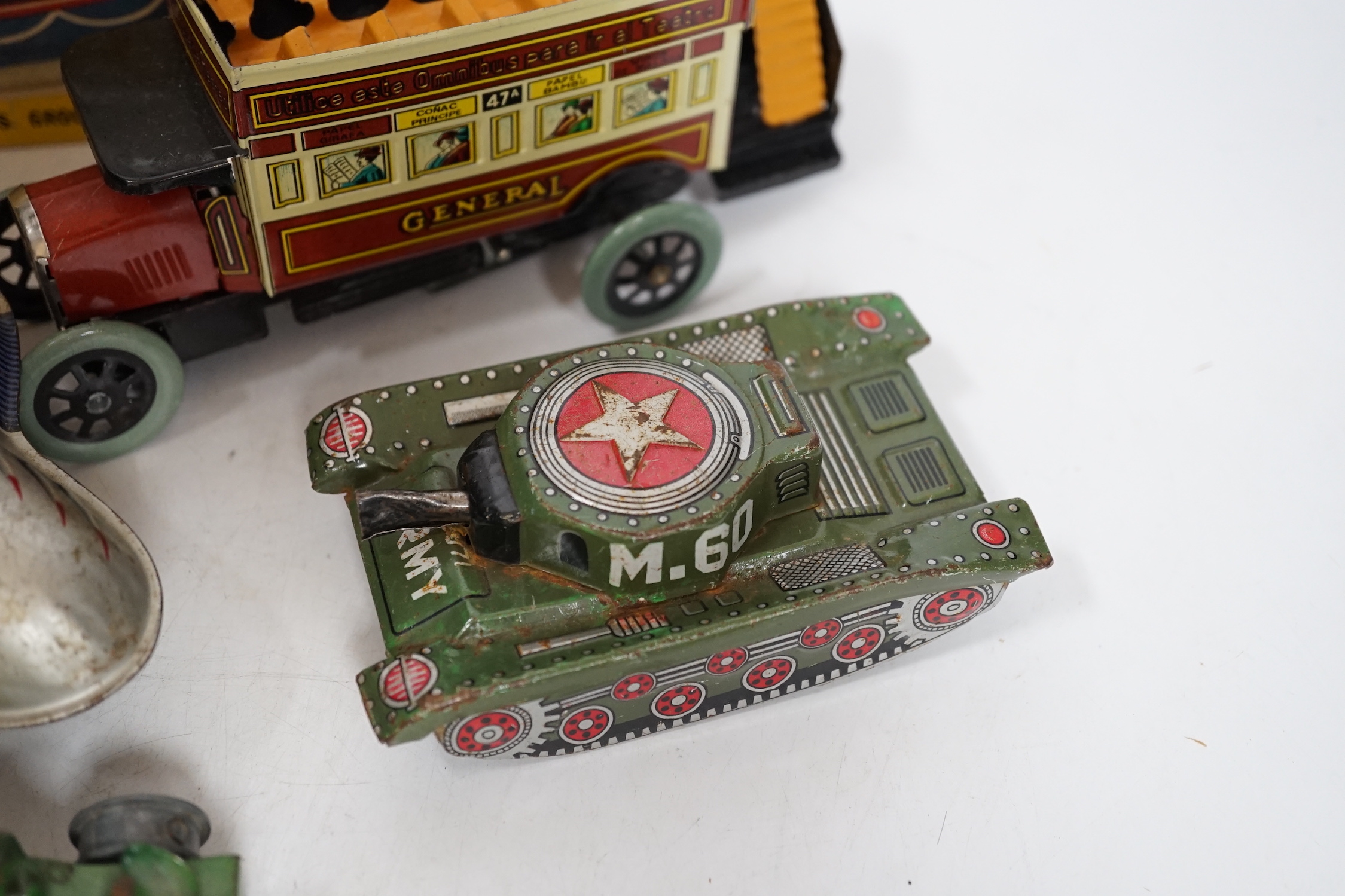 A collection of tinplate toys including cars, a fire engine, a Firebird jet plane, a Tri-ang lifeboat, an Tri-ang Minic tractor, etc. (11), together with a box of boardgames including Vintage Gibson and others; Bandit Ch